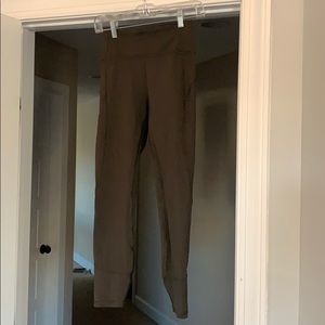 In movement Lululemon tights in dark olive